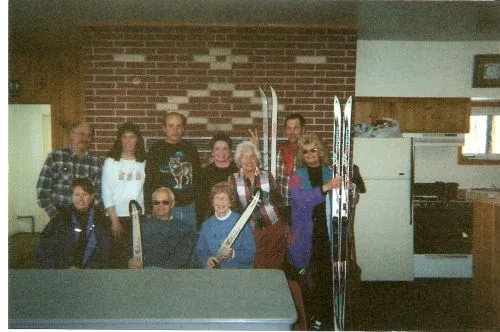 CWN members holding cross-country skis before a ski outing